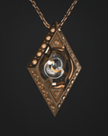 Orb Amulet — cast bronze marble pendant on a chain